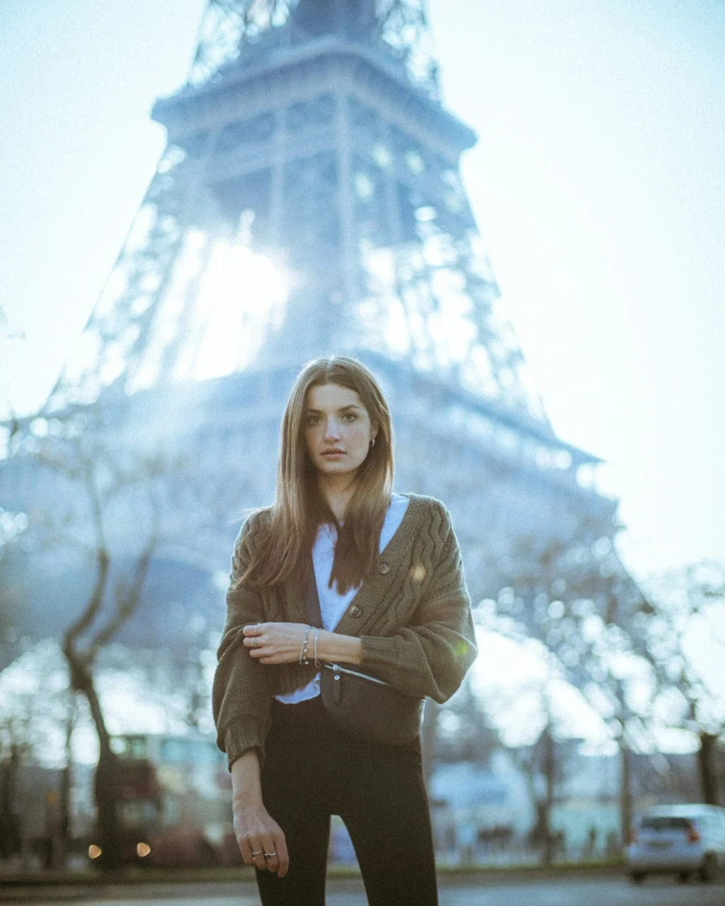 Before: overexposed portrait in front of the Eiffel Tower with a washed-out sky