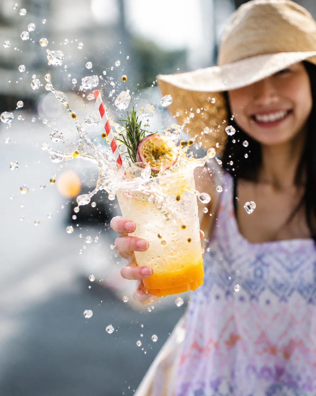 After: the drink bursting out of the cup in a frozen mid-air splash